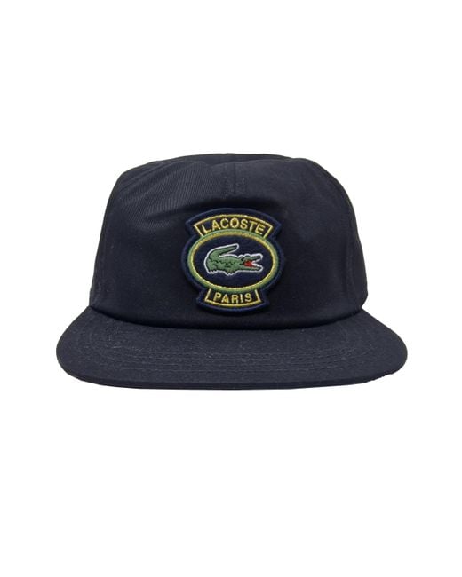 RK7589 Noir Vert Cappellino con distintivo sul davanti di Lacoste in Blue