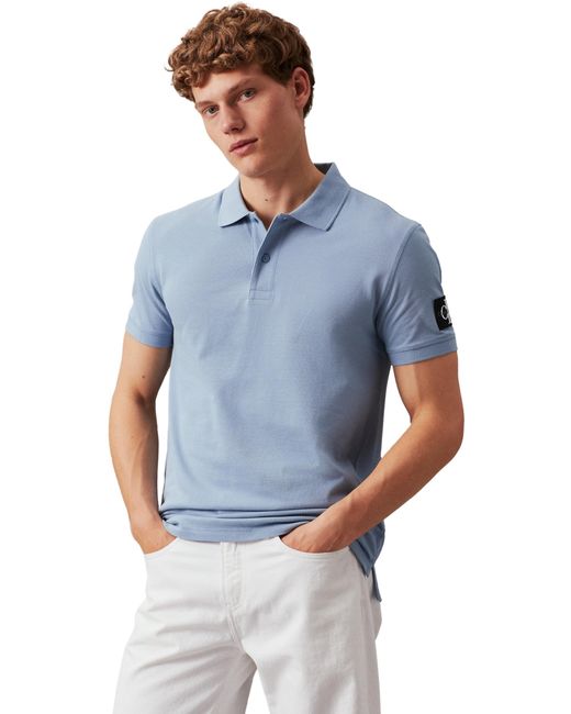 Jeans Polo ches Courtes Badge Regular Fit Calvin Klein pour homme en coloris Blue