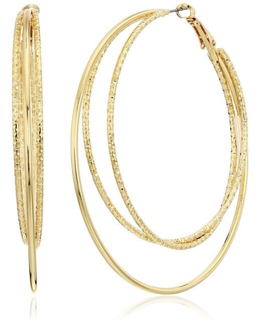 Boucles d'oreilles créoles en fil doré lisse et texturé Guess en coloris Metallic