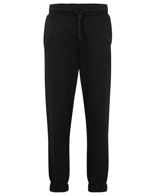 HUGO Black Relaxed-fit Cotton-terry Tracksuit Bottoms With Stacked Logo for men