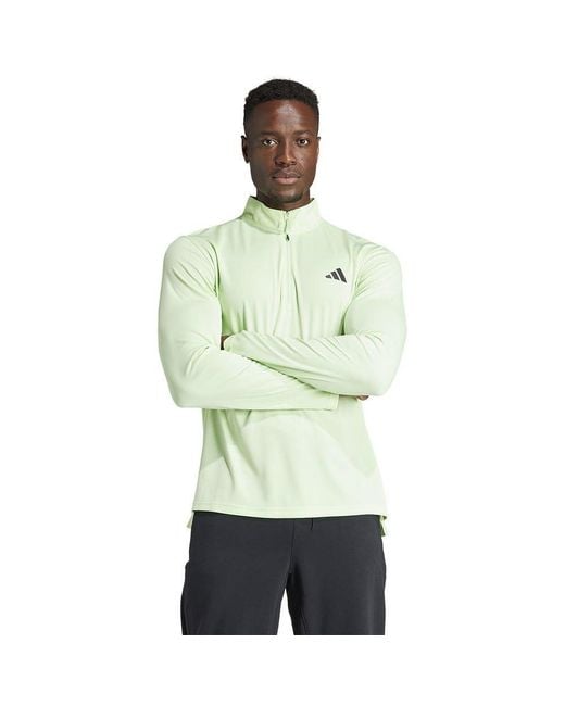 Train Essentials Training 1/4-Zip Long Sleeve Tee Maglia di Tuta di Adidas in Green da Uomo