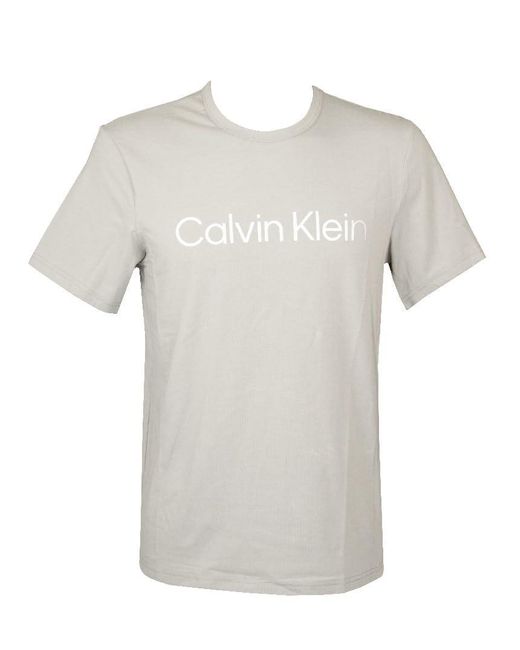 CK NM2264E T-shirt à manches courtes et col rond avec logo imprimé sur le devant pour homme Calvin Klein pour homme en coloris White