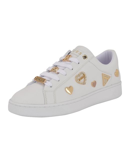 white and gold guess shoes