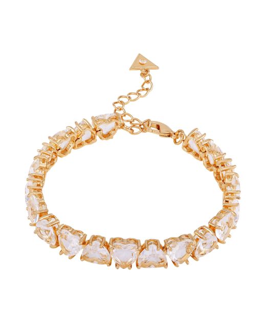 Braccialetto con ciondolo a forma di cuore in vetro trasparente dorato di Guess in Metallic