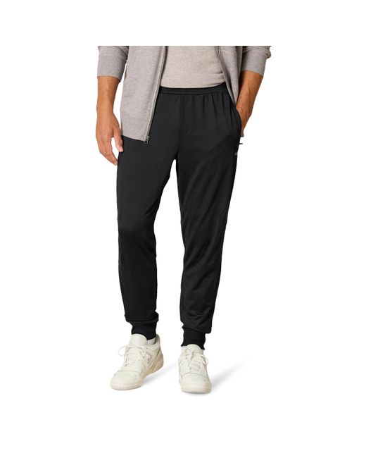 Pantalón Jogger de Alto Rendimiento en Punto Elástico Hombre Amazon Essentials de hombre de color Black