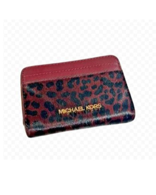 Jet Set Travel Signature Medium Zip Around Card Case Wallet di Michael Kors in Red