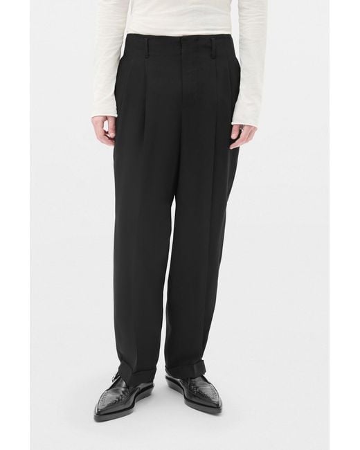 Ann Demeulemeester Black Agdar Pleated Carrot Pants for men