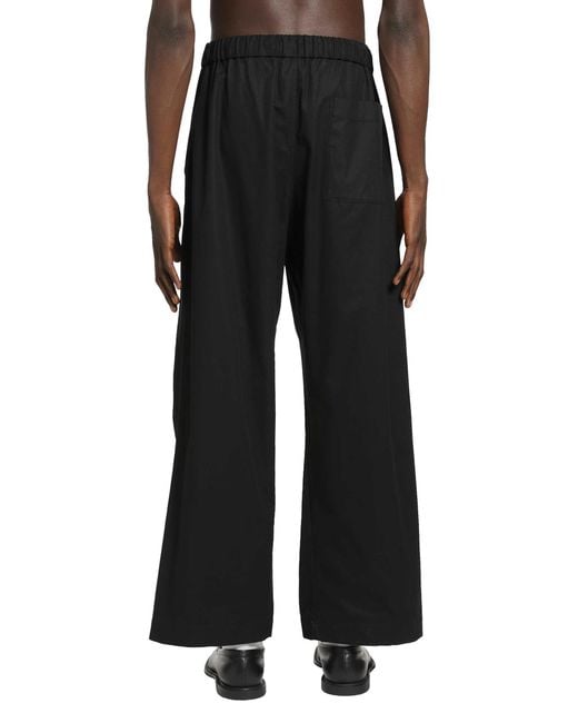 Simone Rocha Black Elasticated Knee Pleat Trousers for men