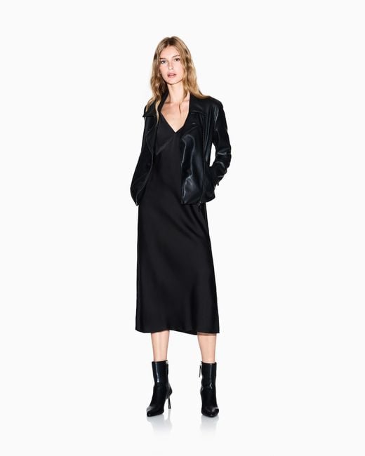 ARMANI EXCHANGE Black Faux Leather Coat With A Diagonal Zip Closure