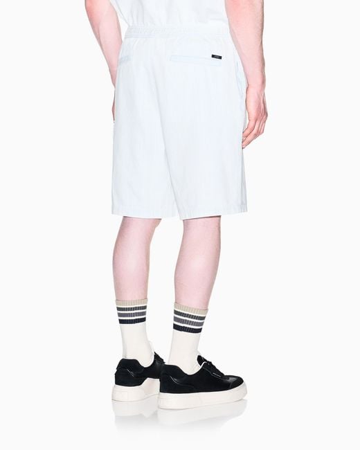 ARMANI EXCHANGE White Light Wash Denim Bermuda Shorts With A Used Effect for men