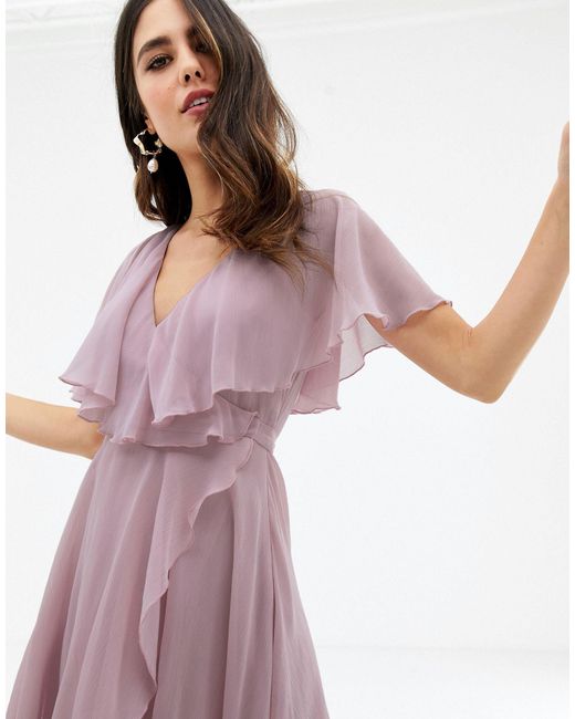 cape back dipped hem dress