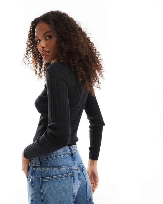 Top A Maniche Lunghe Con Collo Stile Polo di Tommy Hilfiger in Black