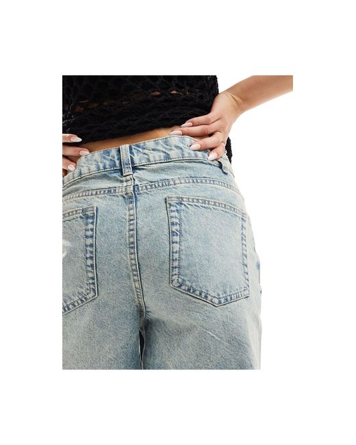 Pantalones cortos vaqueros dad con cintura cruzada en la parte delantera y lavado azul medio ASOS de color Blue