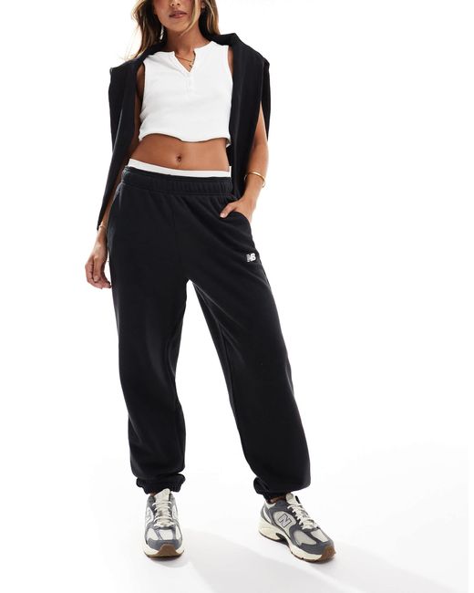 Sport essentials - pantalon New Balance en coloris Blue