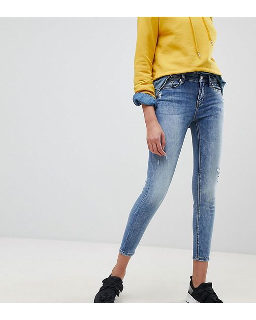 Vaqueros ajustados de tiro bajo Stradivarius de color Azul Lyst