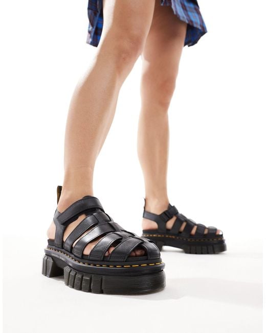 Sandalias negras estilo cangrejeras con suela quad ricki Dr. Martens de color Blue
