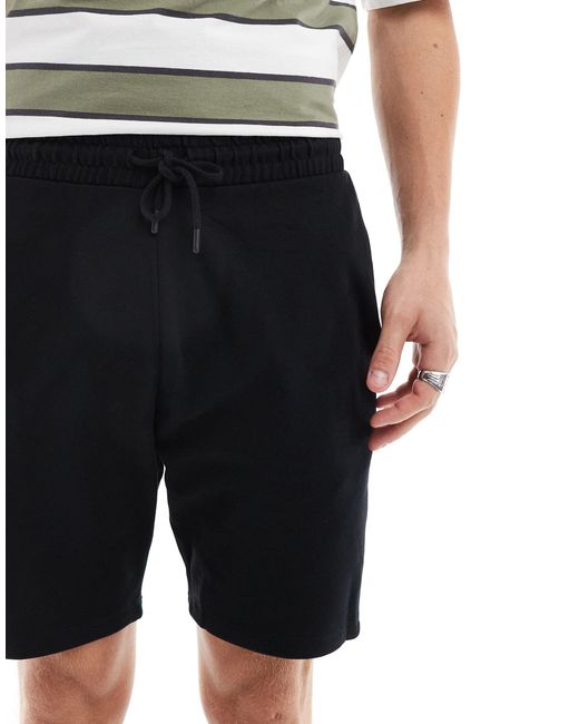Pantalones cortos ajustados en ASOS de hombre de color Black
