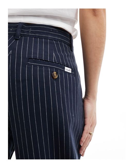 Pantaloni a fondo ampio con motivo gessato a pieghe di Levi's in Blue