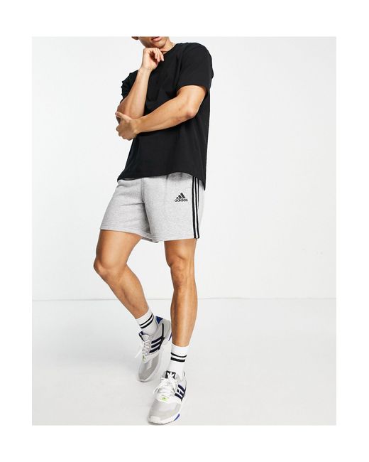 Adidas - sportswear essential - pantaloncini grigi con 3 strisce da Uomo di  adidas Originals in Nero | Lyst
