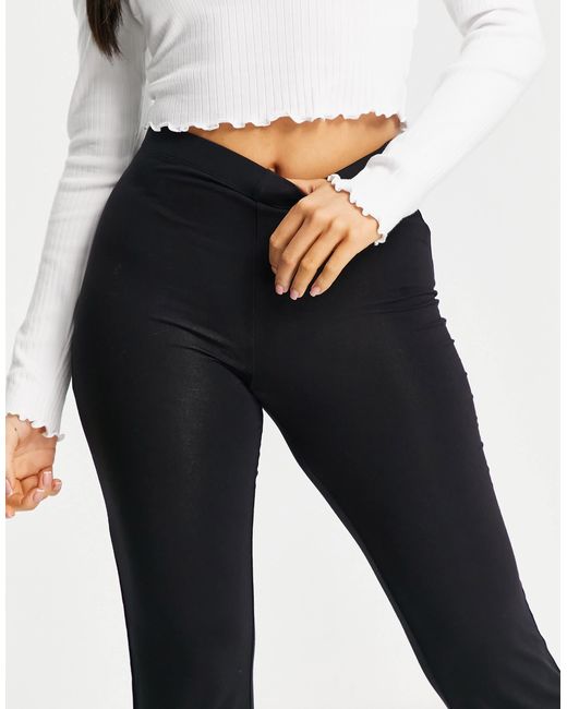 Asos design petite - pantalon évasé ASOS en coloris Black