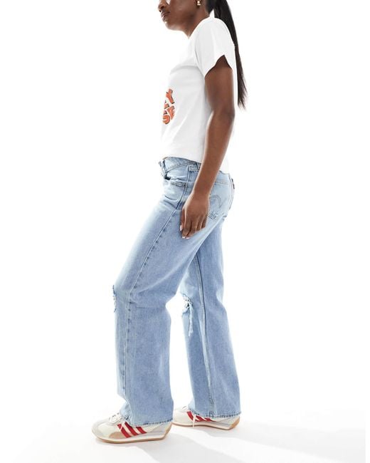 Jean ample déchiré à taille ultra-basse - clair Levi's en coloris Blue
