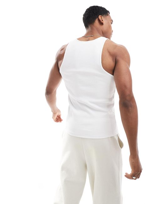 Camiseta blanca ajustada sin mangas con cuello subido ASOS de hombre de color White