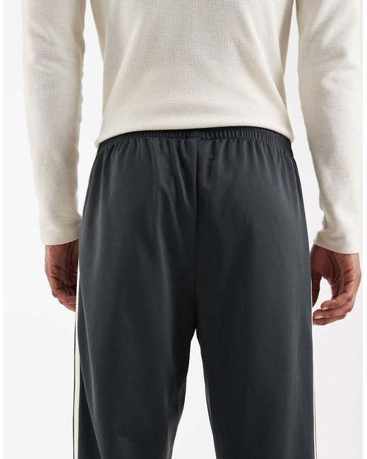 Adidas Originals White Firebird Track Pants for men