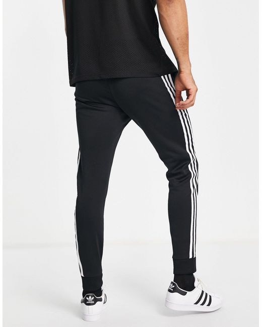 adidas Originals – adicolor – eng geschnittene jogginghose mit den drei  streifen in Schwarz für Herren | Lyst AT