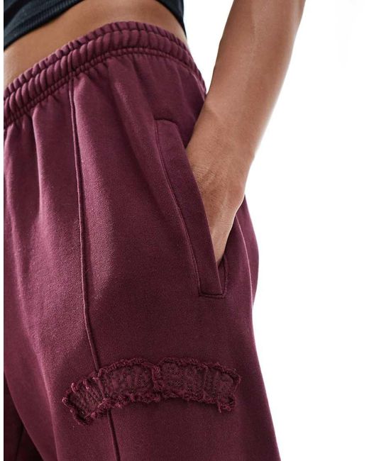 Joggers Burdeos De Pernera Recta Y Corte Ancho Con Logo De Felpa Cepillada De (Parte De Un Conjunto)-Rojo Santa Cruz de color Red