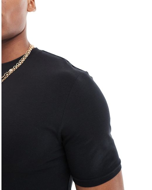 Camiseta negra ajustada studio River Island de hombre de color Black