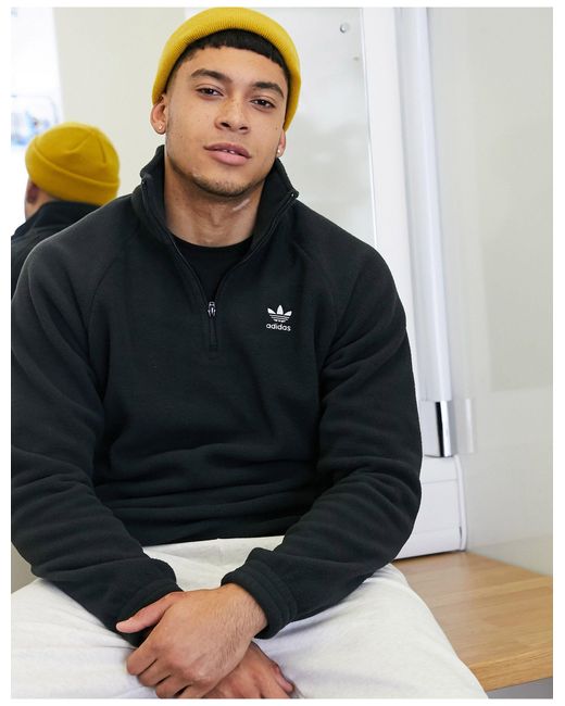 Adidas originals logo quarter zip fleece in black sale