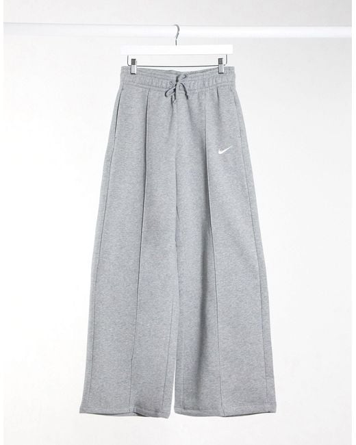 Jogger large à taille haute et petit logo virgule Nike en coloris Gray