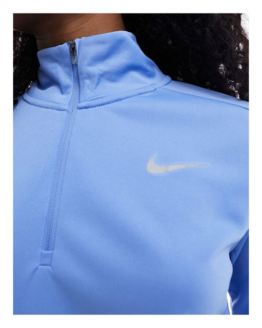 Pacer dri-fit - top a maniche lunghe blu chiaro con zip corta di Nike in Blue