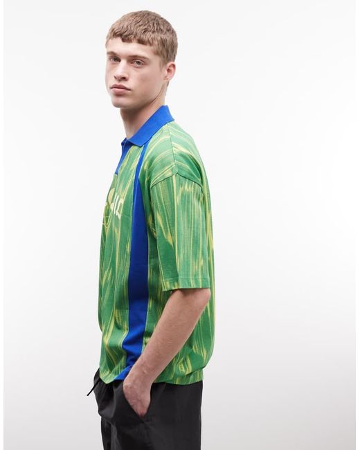 ASOS Green Boxy Oversized Polo With All Over Print And Brazil Football Graphic for men