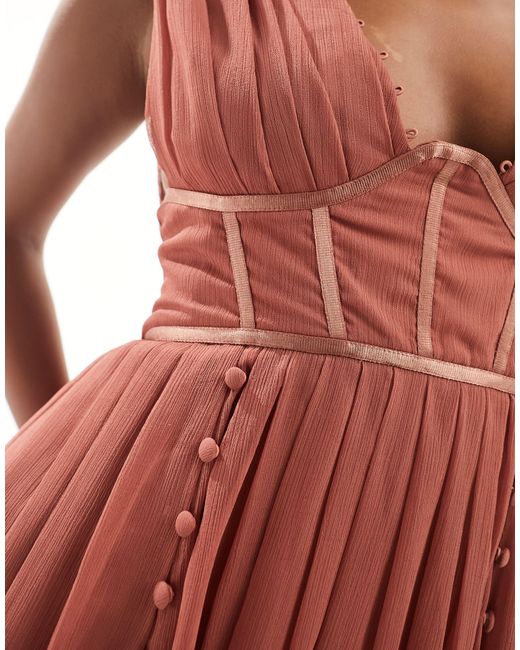 Asos design petite - robe plissée courte à détail boutonné avec décolleté plongeant et corset - vieux rose ASOS en coloris Red