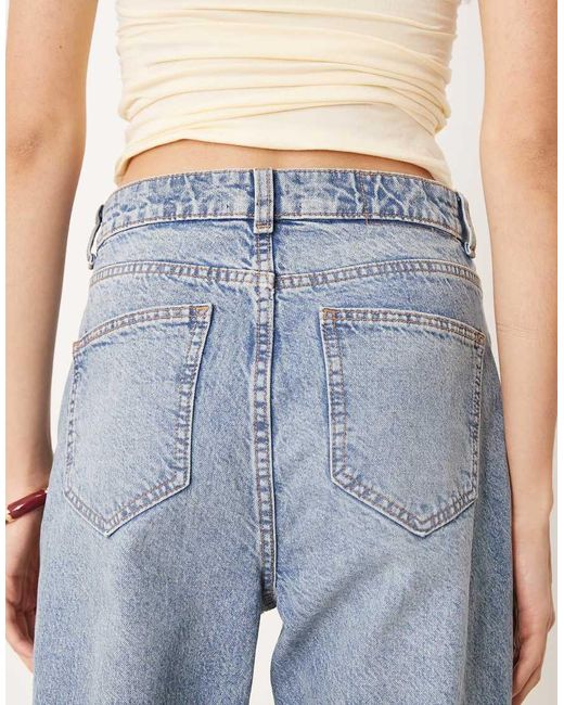 Vaqueros De Corte Recto Y Talle Medio Con Lavado Claro Y Detalles Rasgados Circular Design Collection De Asos Design Tall-Azul ASOS de color Blue