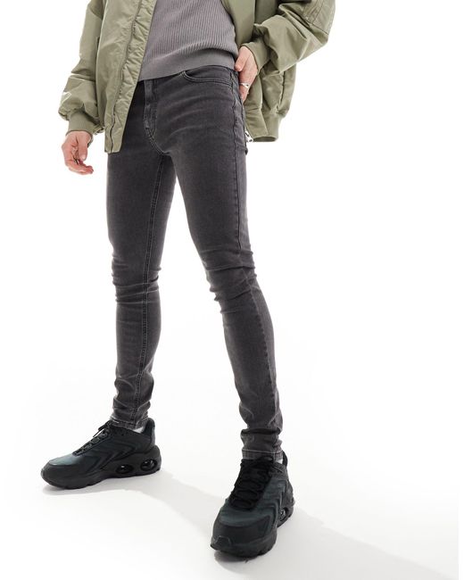 X001 - jean skinny taille mi-haute - délavé Collusion pour homme en coloris Black