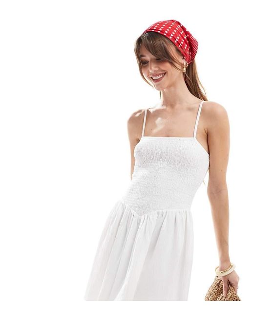 The Frolic White Exclusive Cami Square Neck Shirred Dropped Waist Mini Dress