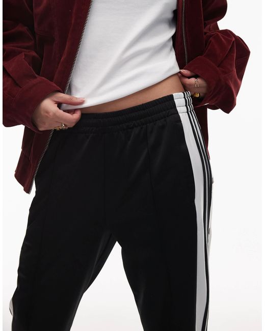 Adibreak - pantalon Adidas Originals en coloris Red