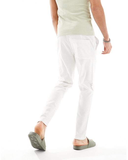 Pantalones color ASOS de hombre de color White