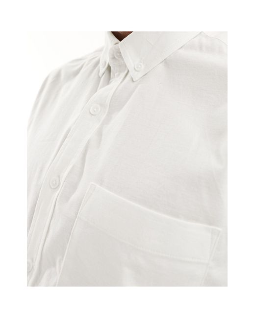 Camicia oxford a maniche corte comoda bianca di ASOS in White da Uomo