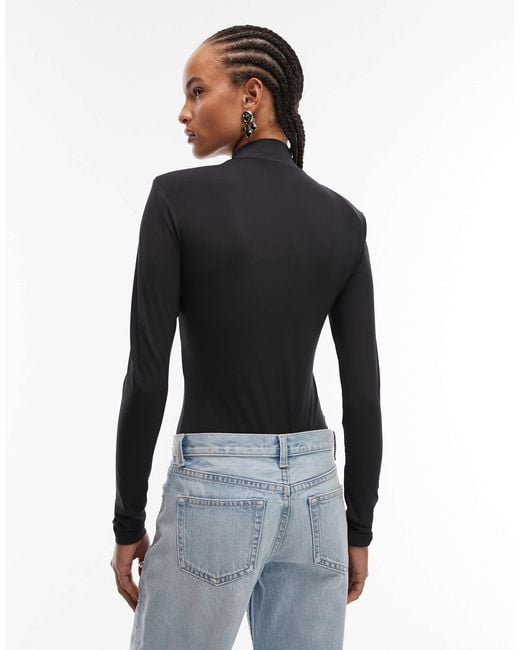 Body près du corps à manches longues avec épaulettes et col montant ASOS en coloris Blue