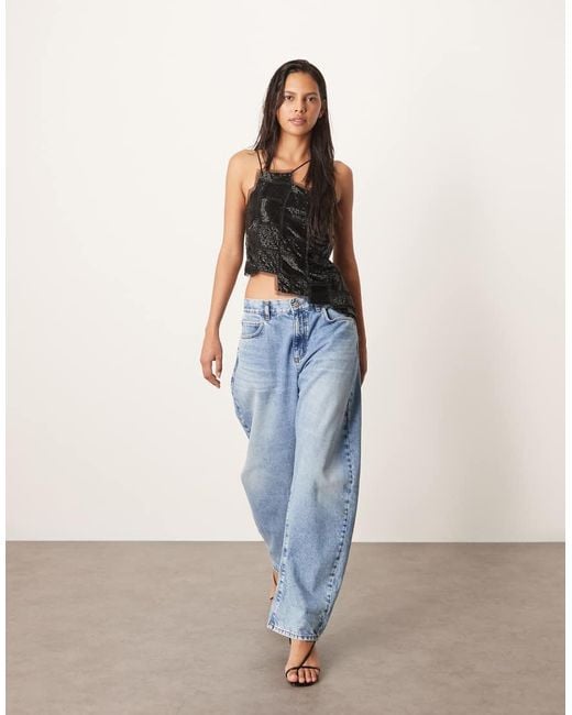 ARRANGE Blue Embellished Asymmetric Top With Raw Edge