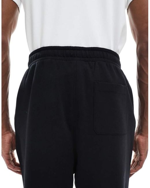 Joggers Negros Holgados Básicos Essentials De ASOS de hombre de color Blue
