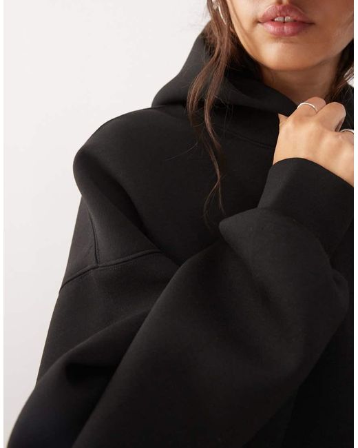 Sudadera Negra Extragrande Con Capucha De Tejido Efecto Neopreno De Weekday de color Black