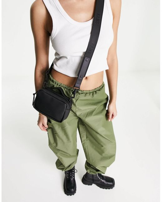 best crossbody bags for the rain RAINS Bum Bag Mini - Waterproof Fanny Pack, Coated Zip The design is finished with an adjustable webbing strap KALIDI Nylon Crossbody Bags for