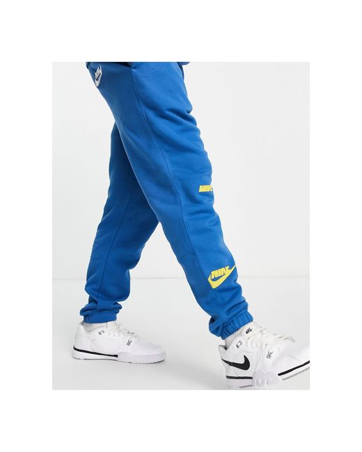 Nike Sport Essentials Multi Futura Logo Fleece joggers in Blue for Men |  Lyst UK