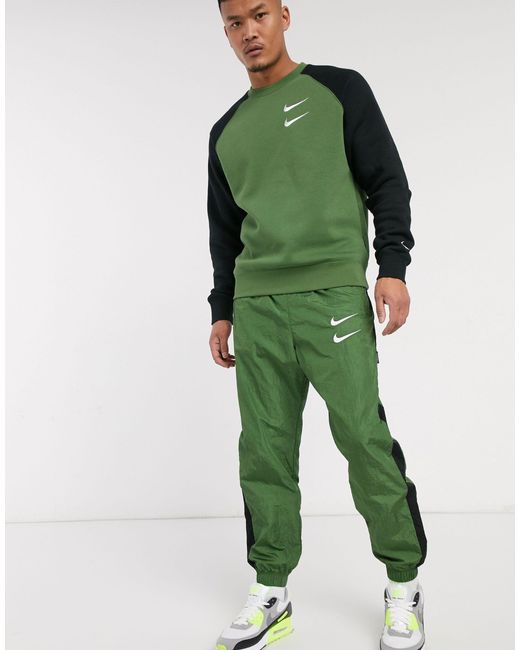 Nike Swoosh - Geweven joggingbroek Met Boorden in het Green voor heren