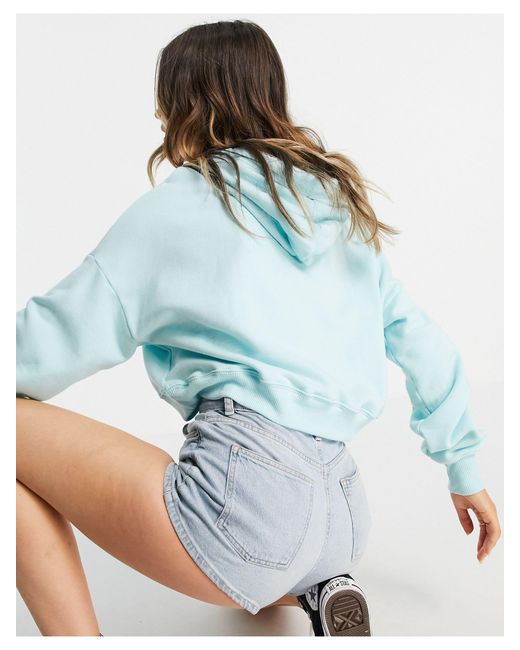 Sweat à capuche court à fleurs avec 