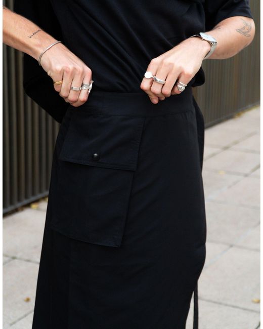 X isaac hudson - jupe utilitaire avec poche Labelrail pour homme en coloris Black